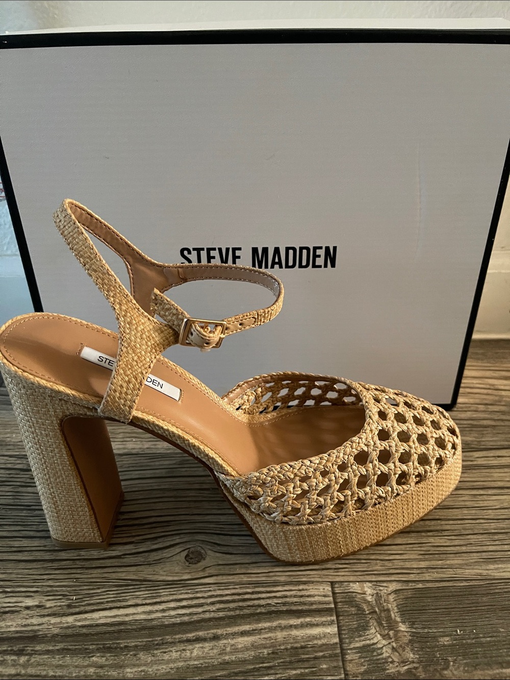 These are tan Steve Madden woven leather block heels with a slingback strap.